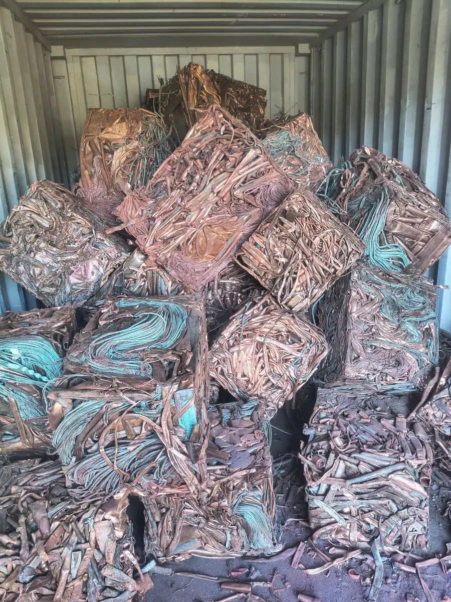 Bales of copper stacked inside a shipping container