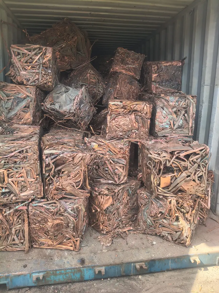 Copper bales packed wall to wall inside a shipping container