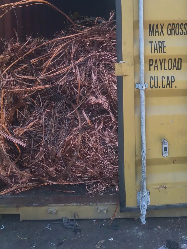 Container door open on a load of bright copper wire
