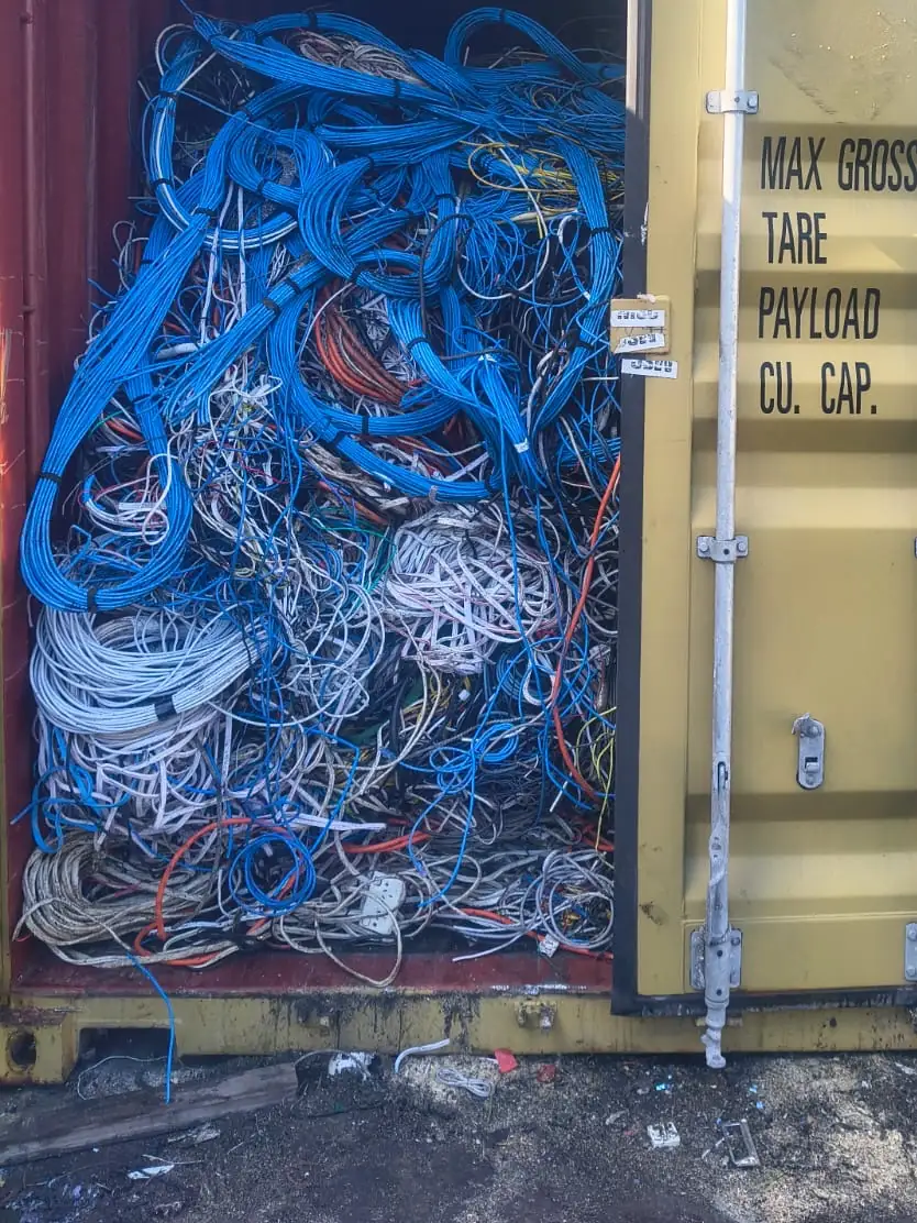 Container door open on a load of blue and white insulated cable