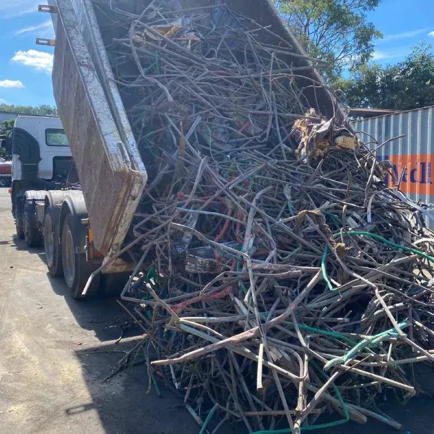 A tipper loaded with collected scrap metal