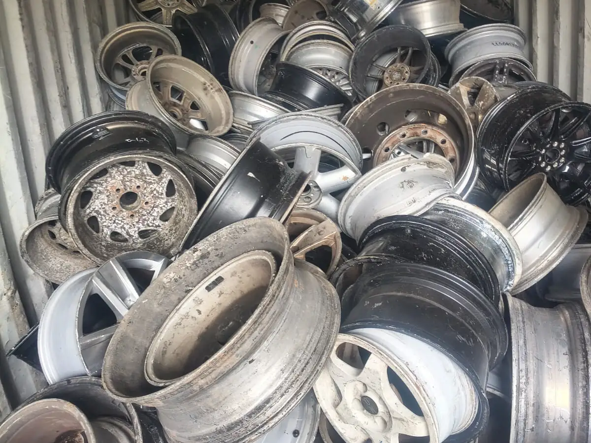 Aluminium wheels loaded loose in a shipping container at the Ingleburn yard