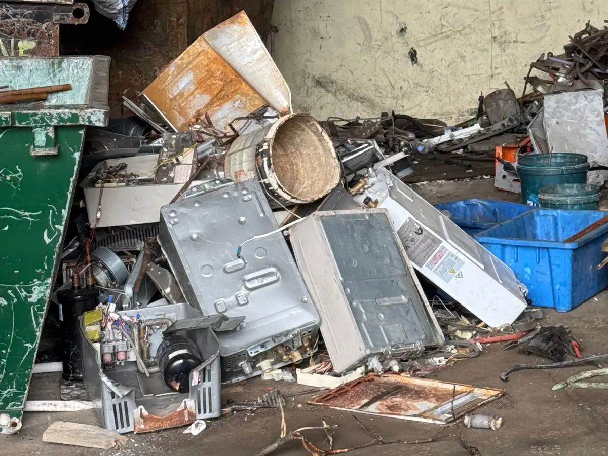 Old household appliances and metal being sorted at the Ingleburn yard
