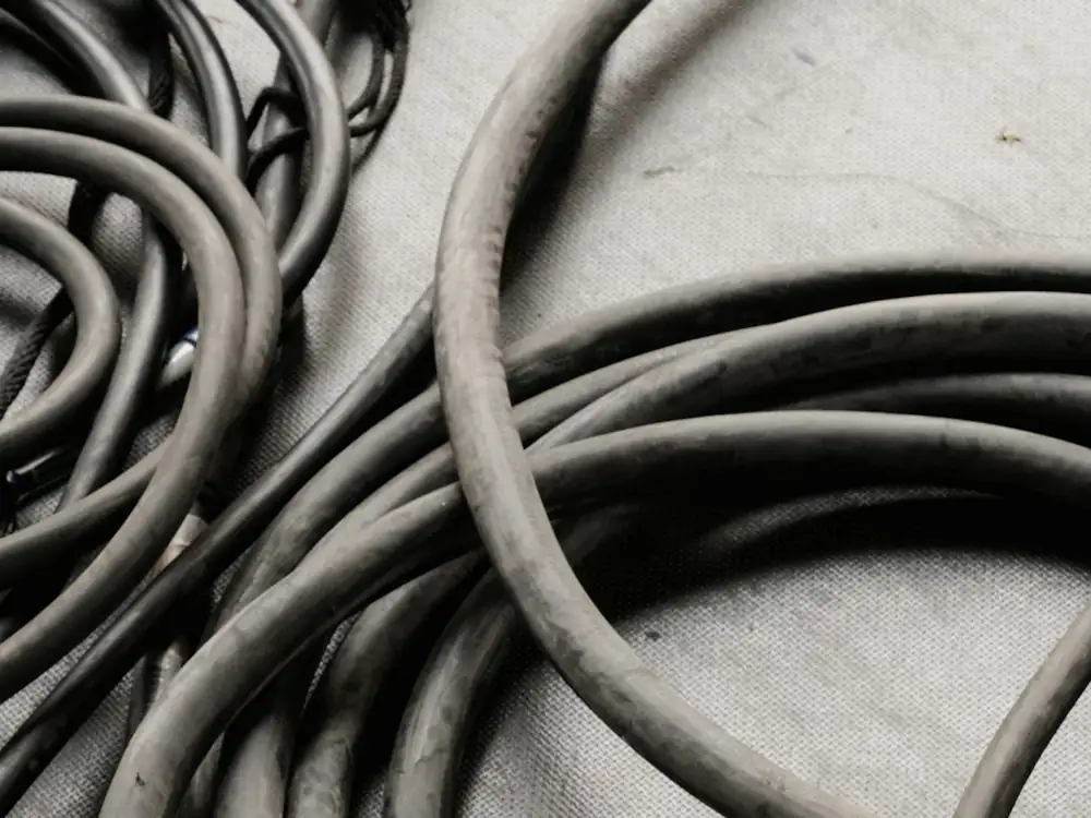 Heavy insulated power cable coiled on the ground