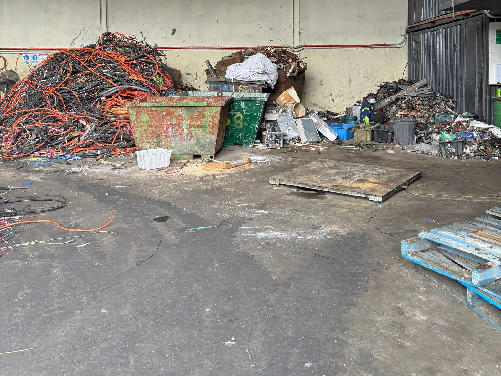 The receiving floor inside the shed at Ingleburn, with the floor scale and bins